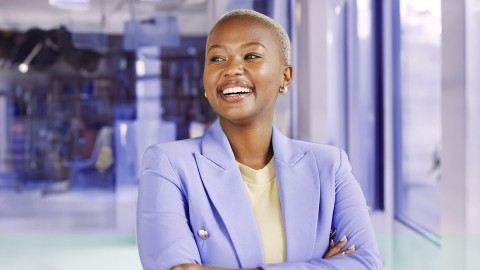 Image of woman smiling inside an office
